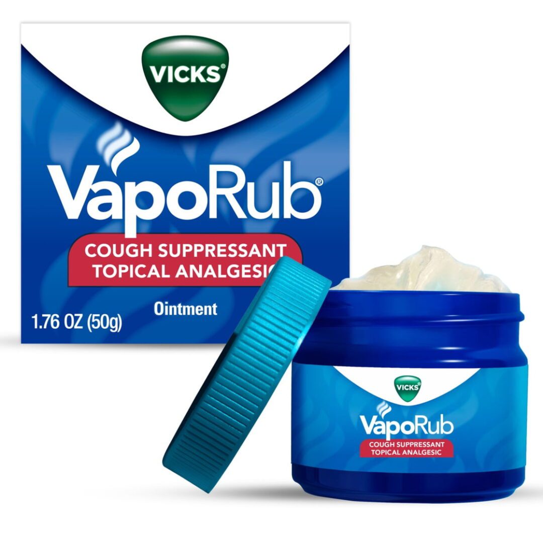 Vicks VapoRub cough suppressant ointment in a blue jar with lid.